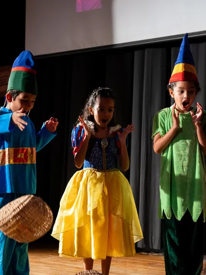 A moment of surprise from Snow White and two dwarfs. This captures the actors' ability to react in unison and create a shared emotional moment.