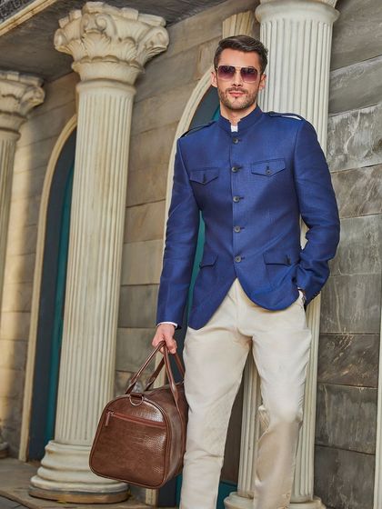 Another shot of the blue hunting-style jacket, demonstrating its sharp silhouette and versatility for both casual and formal settings.