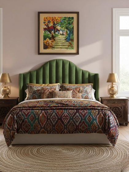 This colorful landscape, another client's creation, is framed to become the centerpiece of a bedroom. The frame's tone was chosen to harmonize with the room's furniture, creating a balanced and inviting space.