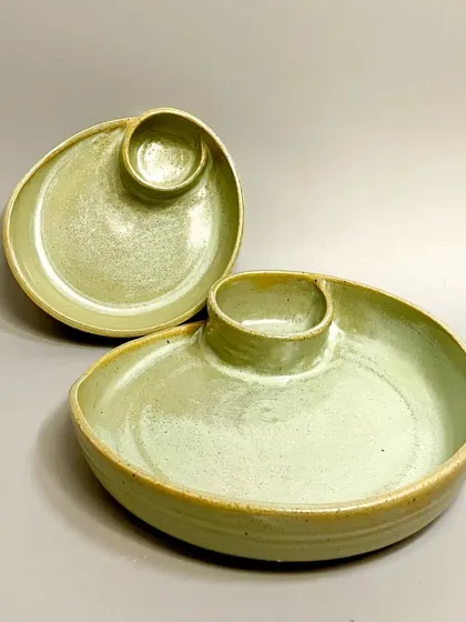 A closer look at the two sizes available for my chip-and-dip sets. The smaller plate nests perfectly inside the larger one, showcasing the thoughtful design of these handcrafted pieces.