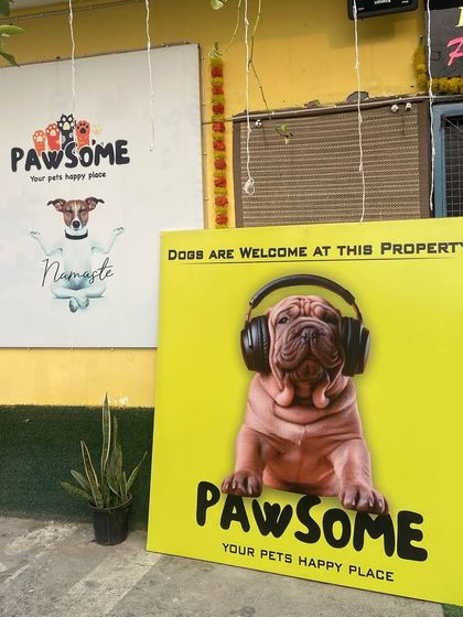 A close-up of our fun signage. The "Namaste" dog perfectly captures our friendly and respectful philosophy towards our furry guests.