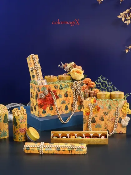 A full view of our yellow forest-themed festive collection, including gift bags of various sizes and matching chocolate boxes.
