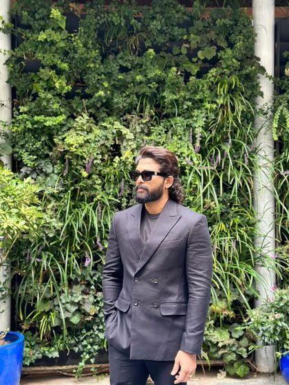 Allu Arjun in London, styled in a custom double-breasted suit from Zafir and Shadab. The dark, textured fabric gives this formal look a modern and moody feel.