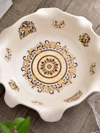 A top-down view of the Victorian serving bowl, highlighting the detailed mandala-like pattern in the center. The craftsmanship makes it as much a piece of art as it is functional serveware.