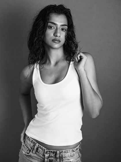 A classic black and white model test shot. The lighting is clean and showcases the model's features and physique.