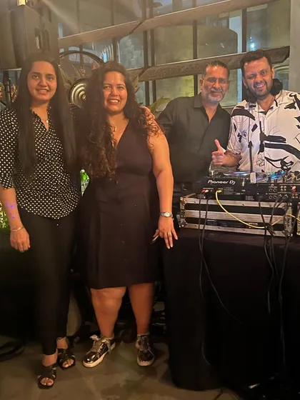 Posing with friends and guests who came to support my gig. It's always special to have familiar faces in the crowd.