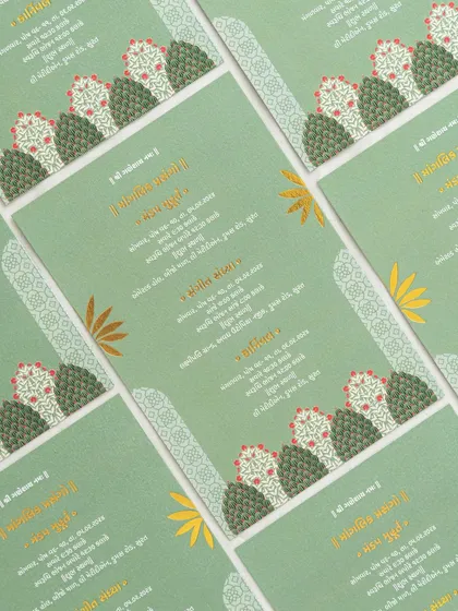 A modern take on a traditional design, this green card uses stylized tree motifs and elegant Gujarati script for a fresh and contemporary feel.