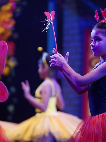 Our little ladybugs, ready with their wands. The detailed costumes and props help bring our fairytale worlds to life.
