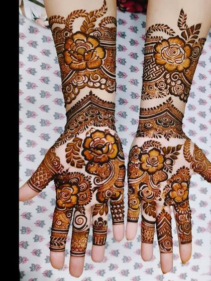 A collection of photos showing the gorgeous results of my henna, from a lighter orange stain to a deep, rich maroon.