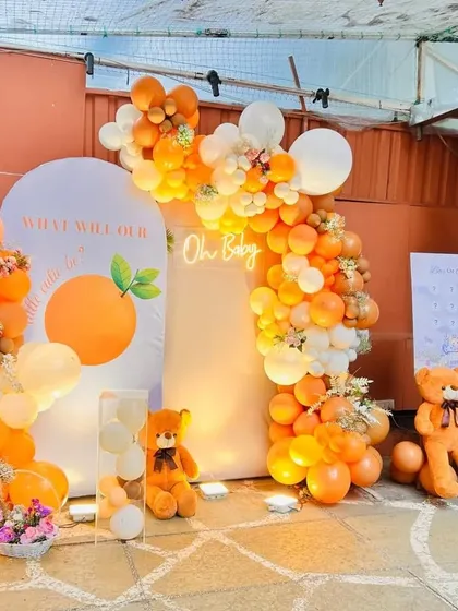 A duplicate image of the 'Little Cutie' baby shower setup, showing the warm and inviting atmosphere created by the decor.