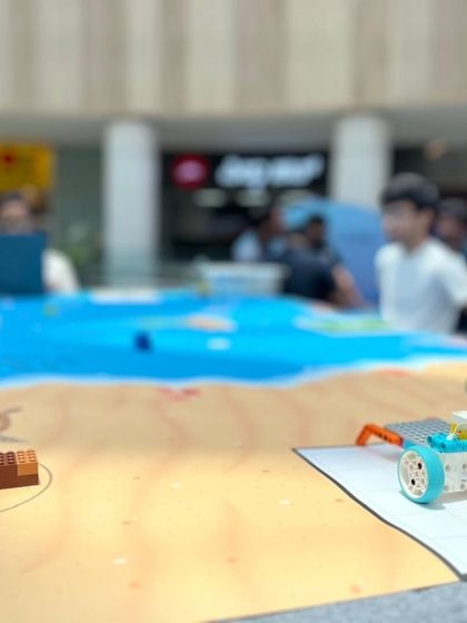 A close-up of the action at our Aquabot Adventure Challenge at Forum Mall. Kids got to program a LEGO robot to navigate a beach and ocean-themed mat.