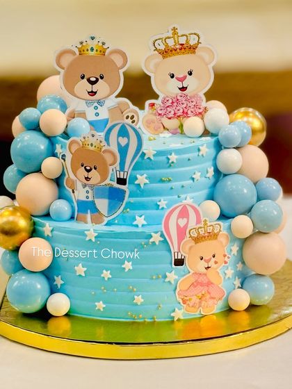 Another angle of the adorable teddy bear themed baby shower cake, showing the placement of the cute toppers and balloon details.