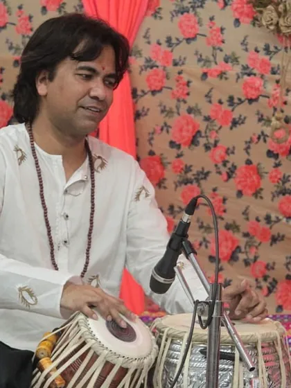 A tabla virtuoso in action during the 'Raghunathanjali' concert. The rhythmic energy of the tabla is an essential component of our live performances.