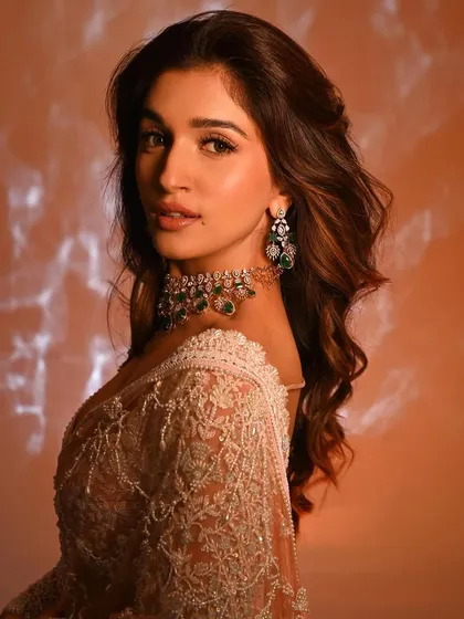 An over-the-shoulder pose that highlights the hair and the side profile. The contouring is soft but effective, enhancing the natural bone structure.
