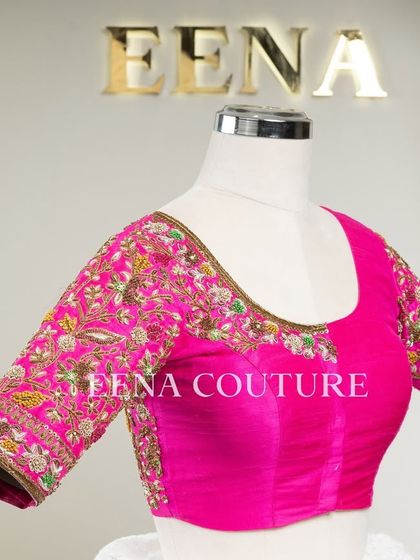 This bright pink raw silk blouse is a showcase of exquisite craftsmanship. The sleeves and back are covered in dense, multi-colored floral handwork, and I added beautiful custom tassels with bead detailing to complete the look.
