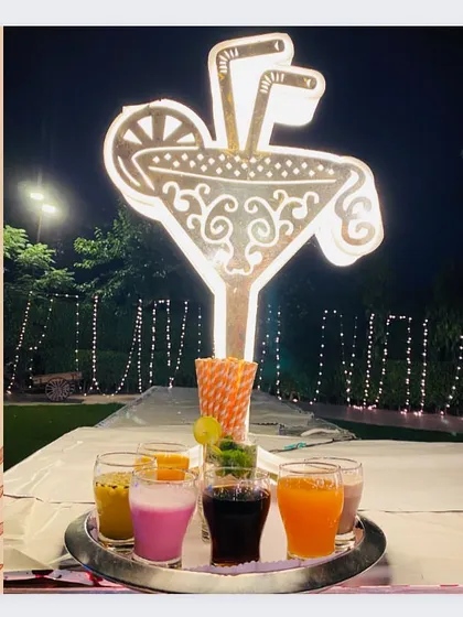 A creative and well-lit mocktail bar sign, inviting guests to enjoy a refreshing drink.