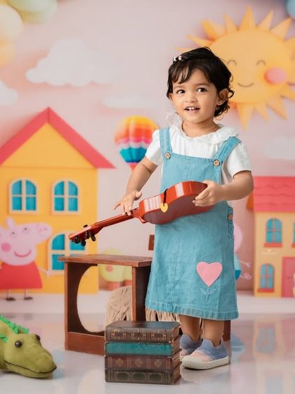 Ready to play a song in her colorful Peppa Pig world.