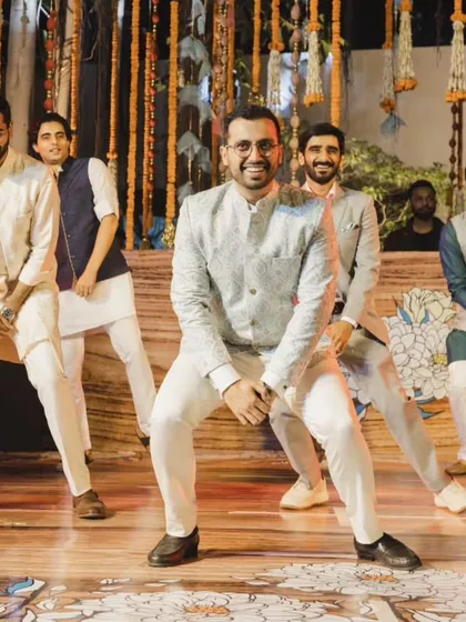 Make way for "The Boys"! This shot captures the fun and playful energy of a groomsmen performance, perfectly coordinated and full of personality.