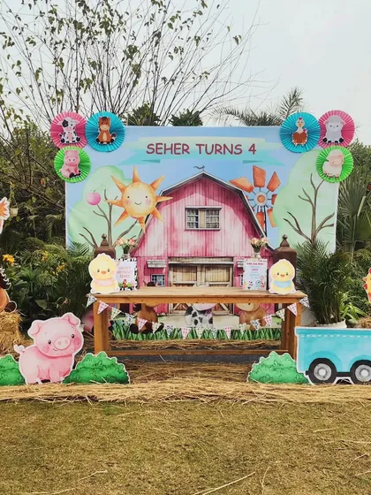 The full view of the main photo and cake area for the farm-themed birthday. The setup is colorful, cheerful, and perfectly captures the fun of a day at the farm.