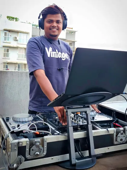 A daytime party setup on a rooftop. Whether it's an indoor sangeet or an outdoor pool party, I bring my professional DJ console and sound system to create the perfect atmosphere for any setting.