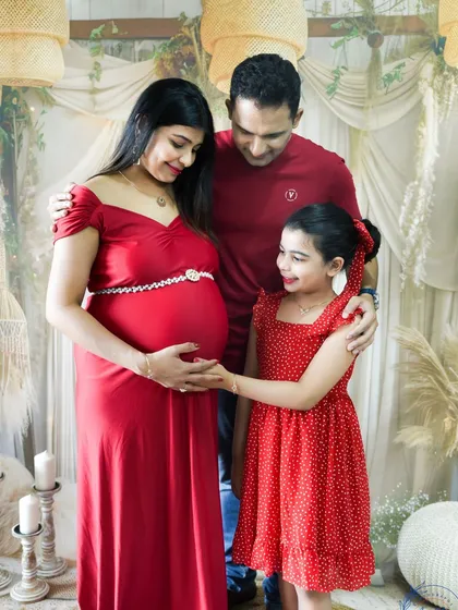 Your whole family is part of this journey. We love including older siblings in our maternity shoots to capture their excitement, like this sweet moment as a big sister-to-be meets her new sibling.