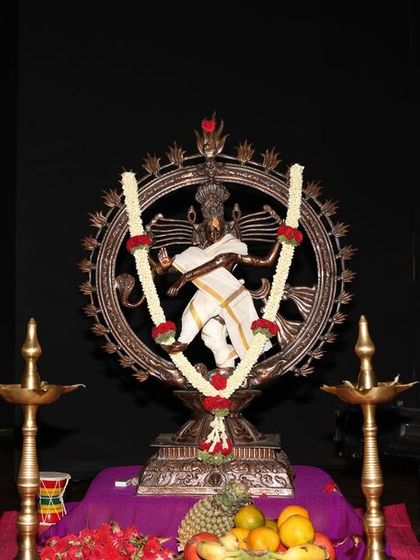 The traditional stage setup for the Sadhana Classical Dance Festival, with a beautiful Nataraja idol and lamps. We honor the traditions of our art form in every performance.