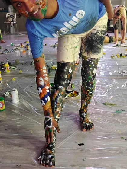 The beautiful chaos of a body painting workshop in full swing. This is where people let go of their inhibitions and connect on a deeper level, using paint and touch. It’s a sensory experience that’s perfect for wellness retreats, private parties, and inclusive community events.