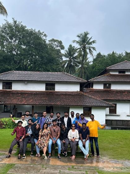 Our trekking group posing in front of the iconic Kavimane, soaking in the literary and cultural history of the region.
