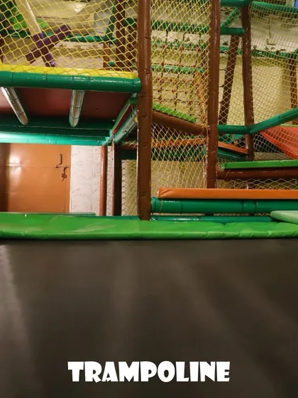 The trampoline area is perfect for kids to burn off energy. It's a safe, netted-in space where they can jump, bounce, and have a fantastic time.