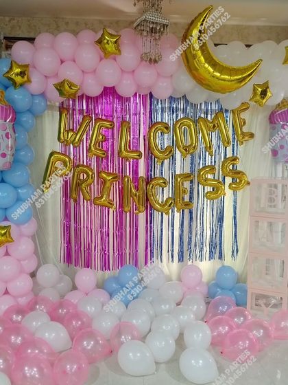 A "Welcome Princess" decoration with a pink, blue, and gold theme, featuring a moon and stars.