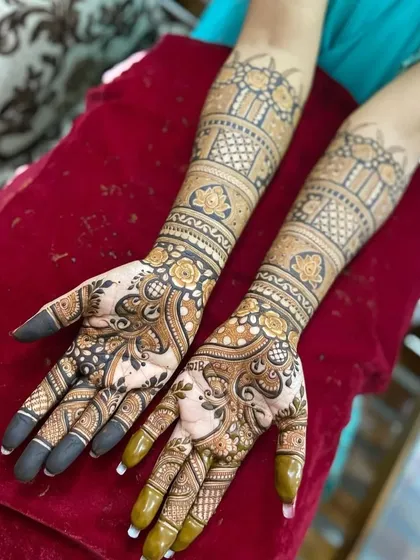 Another view of a stunning full coverage design after the henna paste has been removed. The floral and vine patterns are incredibly detailed and the color is rich and even.
