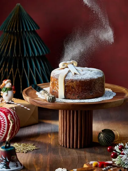 There's magic in a simple action. This shot for Marriott Bonvoy's Christmas campaign captures the moment of dusting a festive cake with powdered sugar. The motion adds a touch of holiday cheer and brings the dessert to life.