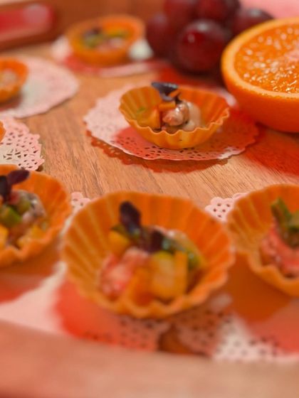 Delicate cheese canapés served at the Diesel event. These bite-sized tarts are filled with a creamy cheese mixture and garnished for a touch of elegance.