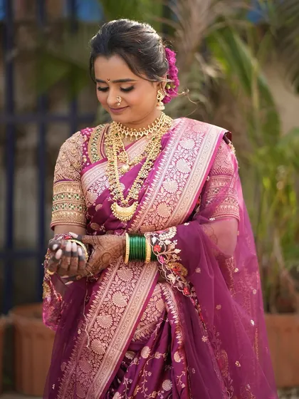 Another beautiful shot of Meghana, highlighting the intricate details of her saree and jewelry.