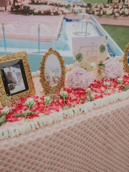 A "Generations of Love" table honoring the family's legacy. We displayed cherished family wedding photos in ornate golden frames, creating a beautiful tribute to the love that paved the way for the new couple.