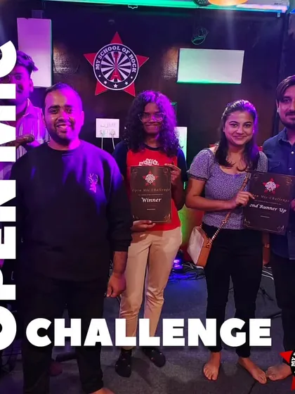 The winners of an Open Mic Challenge, proudly holding their certificates. We believe in recognizing and rewarding talent.