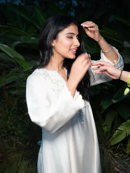 A behind-the-scenes moment with Nayab, getting ready for her performance. Even the prep shots show the clean and polished base of the final look.