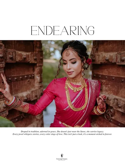 A bride, draped in a stunning pink wedding saree, framed by a traditional carved wooden doorway. My work often incorporates architectural elements to add depth and context to your story.