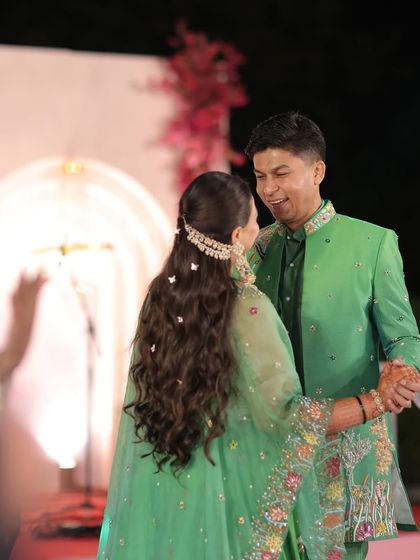 Another beautiful moment between the couple, with the bride's romantic butterfly hairstyle on full display. This style is perfect for creating memorable wedding photos.