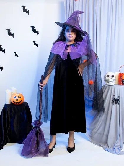 To showcase my versatility, here is a full-length shot from a kids' apparel project. We created a complete Halloween-themed set in the studio for this witch costume, including props and specific lighting to create a fun, spooky mood perfect for seasonal e-commerce listings.