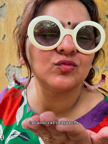 A fun shot of me wearing the maroon hoops and my favorite sunnies. They are all about effortless style.