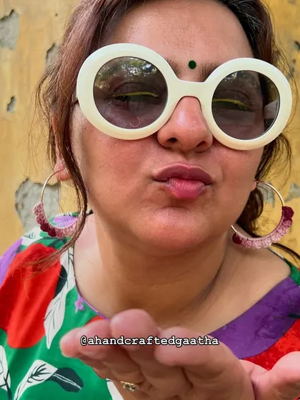 A fun shot of me wearing the maroon hoops and my favorite sunnies. They are all about effortless style.