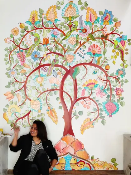 Here I am with a completed Kalamkari 'Tree of Life' mural, a piece that connects deeply with our Indian artistic roots. This style is perfect for adding a meaningful and vibrant story to a large feature wall in a home.