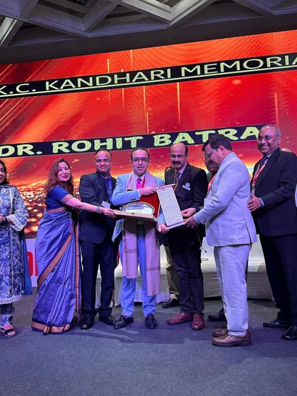 A closer look at the moment I received the K.C. Kandhari Memorial Award. This award is a testament to our entire team's dedication to excellence in the field of dermatology.