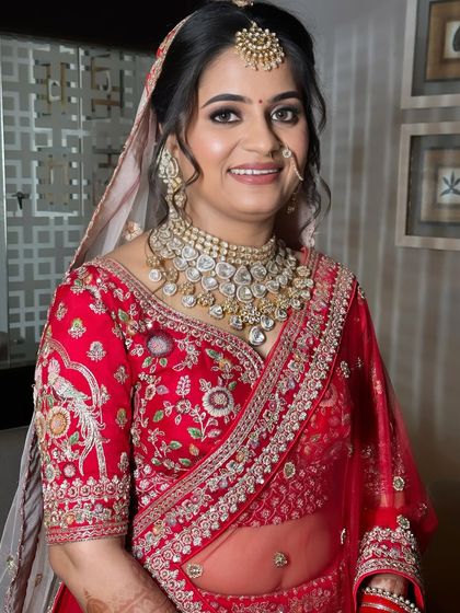 A close-up of the bride's happy expression. The makeup is designed to enhance her natural smile and radiance.