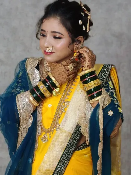 Another beautiful shot of Urmila, highlighting the perfect draping of her net shela, which we styled with a unique twist.