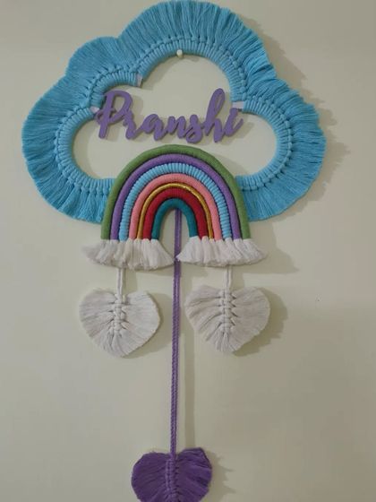 This personalised macrame wall hanging is a perfect addition to a child's room. I can customise the name and colours to create a unique piece of decor.