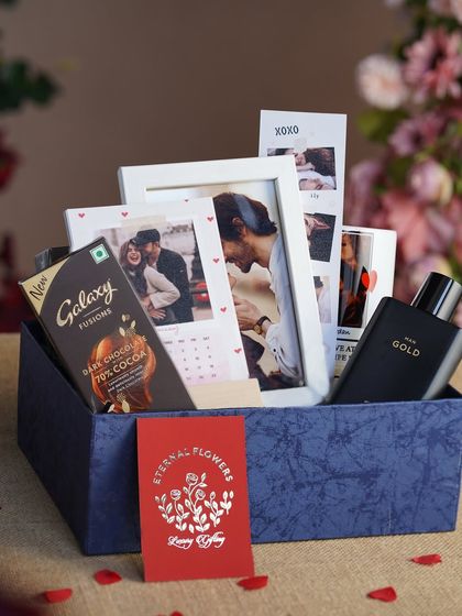 The 'Sweetheart's Delight' hamper packed in a stylish blue box, filled with personalized mementos and treats.