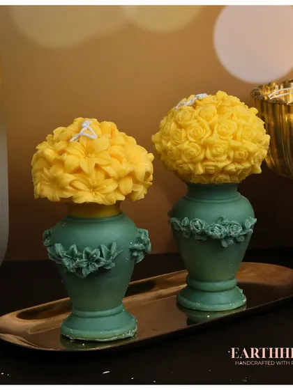 The flower vase pillar candles in a cool-toned yellow and green, perfect for a fresh, spring-like feel.