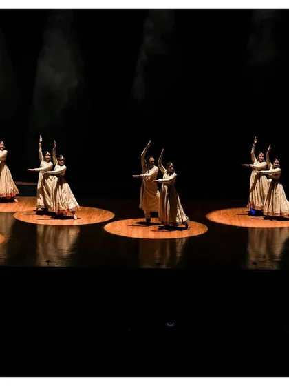 In every footstep, a story unfolds. This image captures the synchronized grace of our Kathak dancers, their movements weaving an enchanting tale of rhythm and expression.